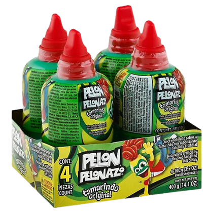 A photo of a clear plastic bottle filled with a brownish-red sticky liquid, with a label that reads "Pelon Pelonazo Tamarindo." The bottle has a green cap and is tilted to the side, with the liquid pouring out in a stream. In the background, there are blurred images of other products on a store shelf.